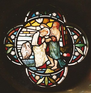 the stained glass of Jesus Baptism
